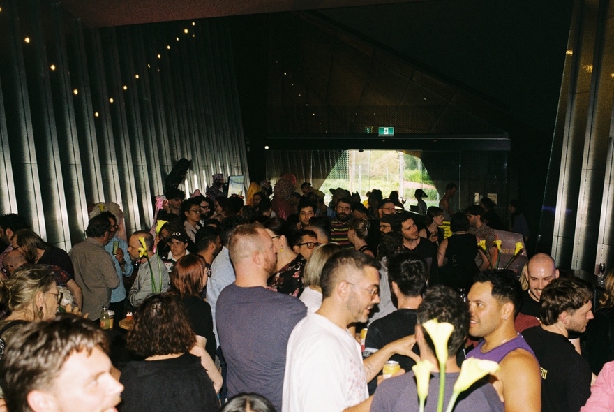 A crowd of people enjoying an after hours party at the Australian Centre for Contemporary Art.