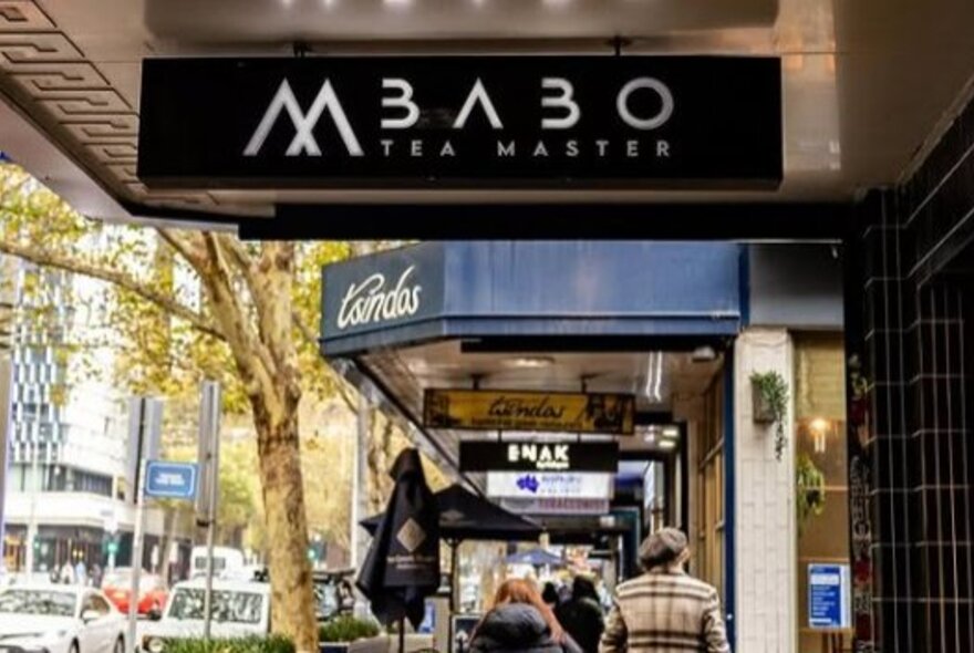 Hanging overhead sign of the Mr Babo Tea shop in a Melbourne city street.