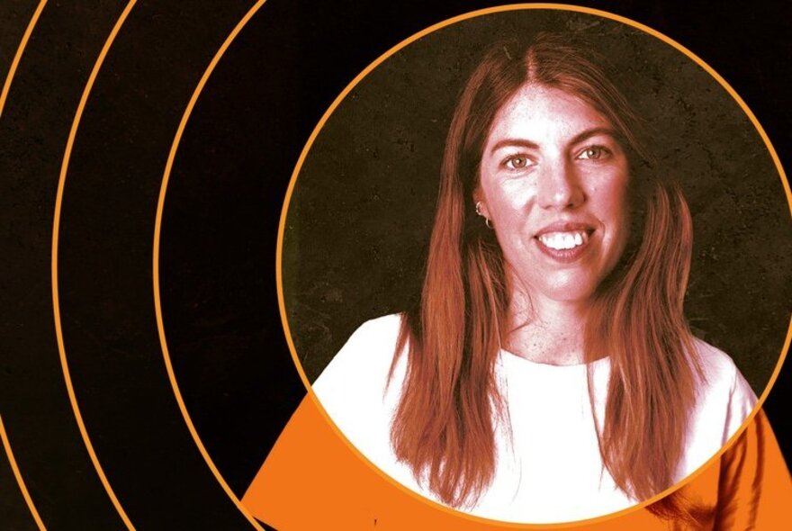 A portrait of a smiling young woman with long brown hair, a set of concentric circles surrounding her face.