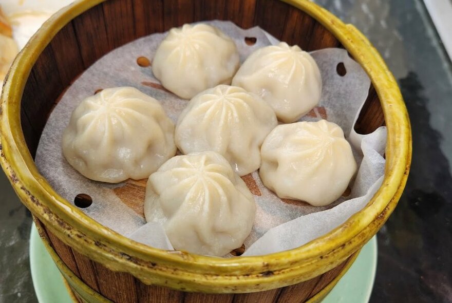 Dumplings in a bamboo steamer.