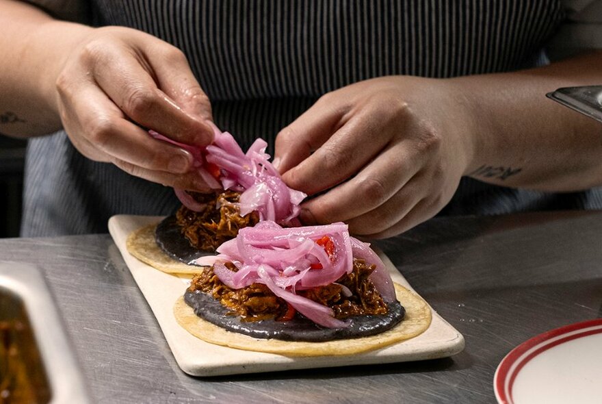 Chef preparing tacos.