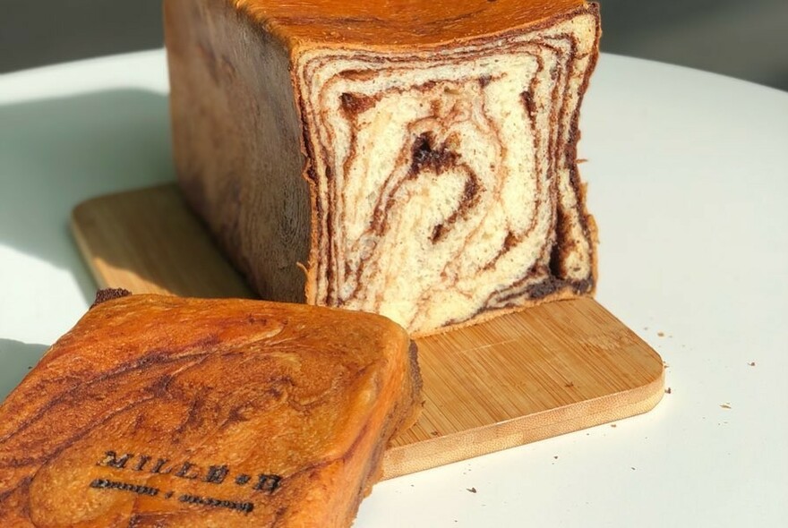 Rectangular cake cut to show swirl pattern inside.