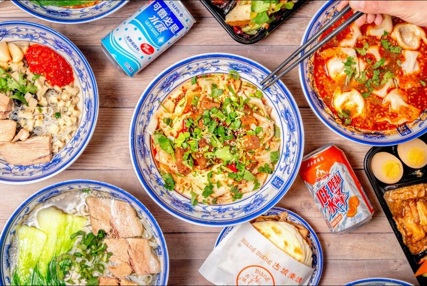 Bowls of Chinese food, viewed from above.