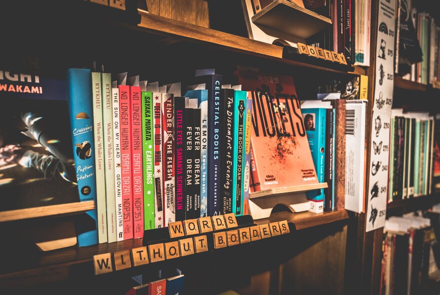 Bookshelves with inspiring words in Scrabble tiles.
