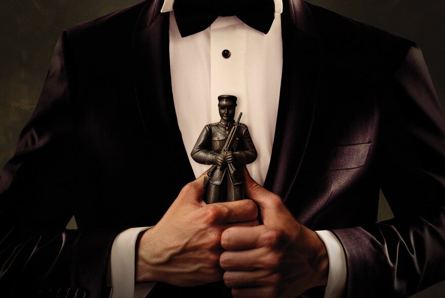 The torso of a man in a tuxedo clutching a toy soldier to his chest.