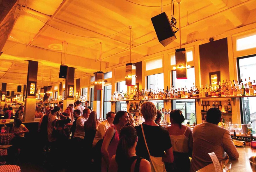 Crowd of people waiting to be served at the bar area of the Toff in Town.