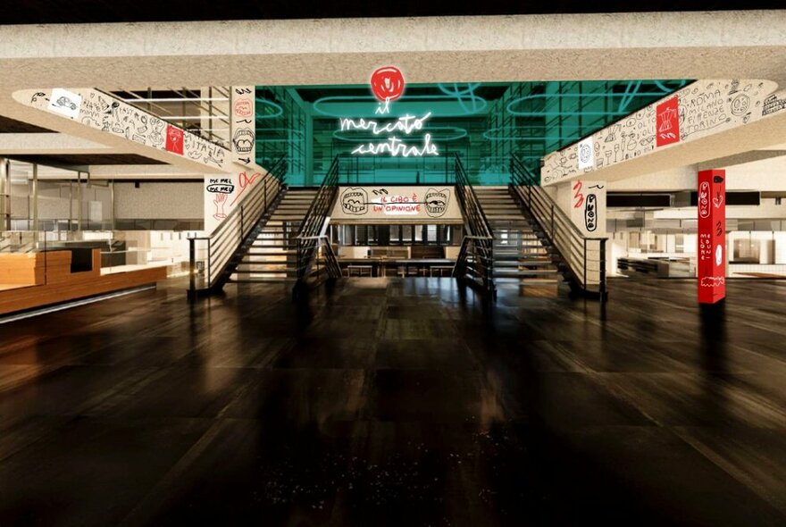 Empty interior of il Mercato Central in Melbourne, showing large staircase leading to a first floor, and smaller counters around the side walls.