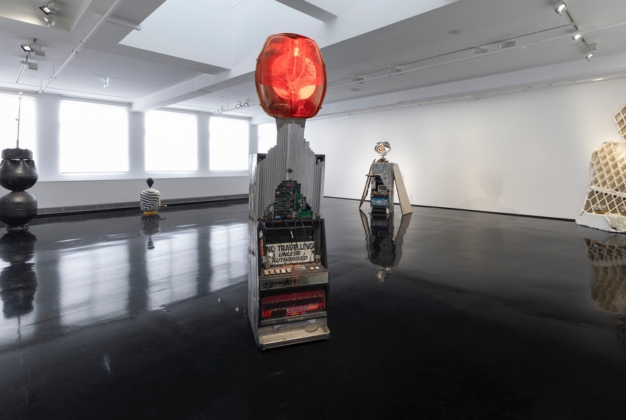 Installation view of an exhibition of  sculptures by the Australian artist collective Tennant Creek Brio, known for repurposing found objects into art. 