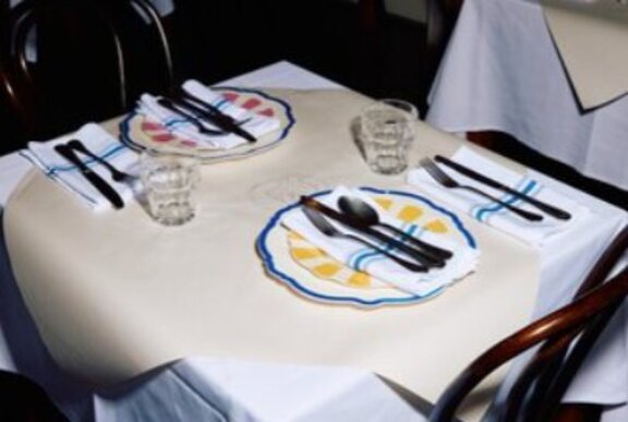 Restaurant table set for dinner.