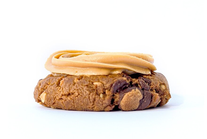 A choc-chip biscuit topped with whipped peanut butter.