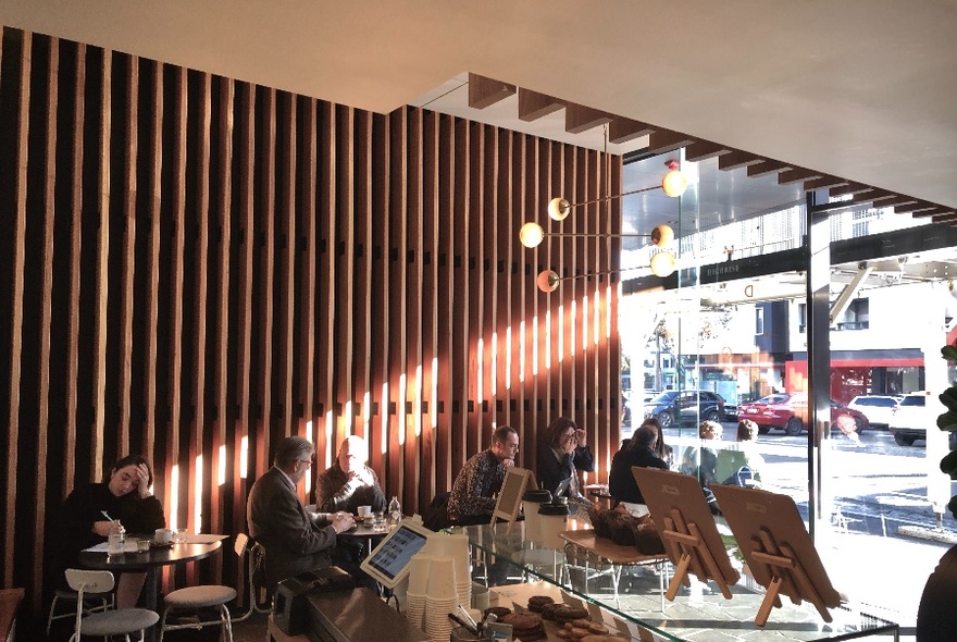 People seated in a cafe.