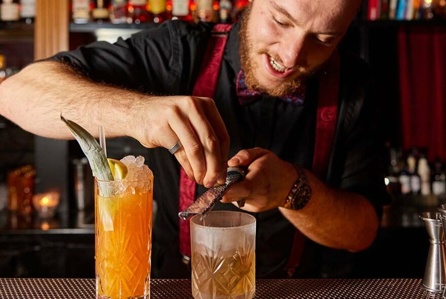 Barman preparing drinks.