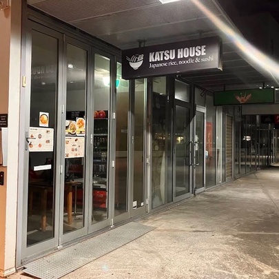 Exterior of Katsu House restaurant at night. 