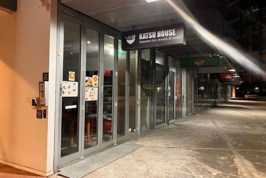 Exterior of Katsu House restaurant at night. 