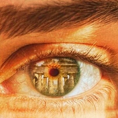 Eye close-up with reflection of ancient Greek temple.