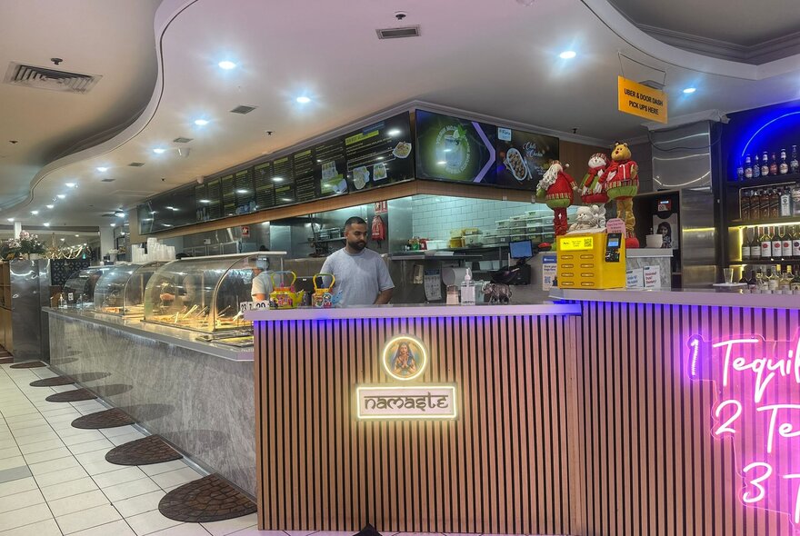 Restaurant counter with bain marie and cooking area.
