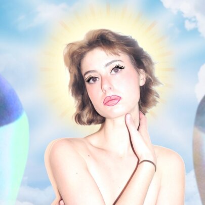 A portrait of a beautiful woman with a celestial sky behind her.
