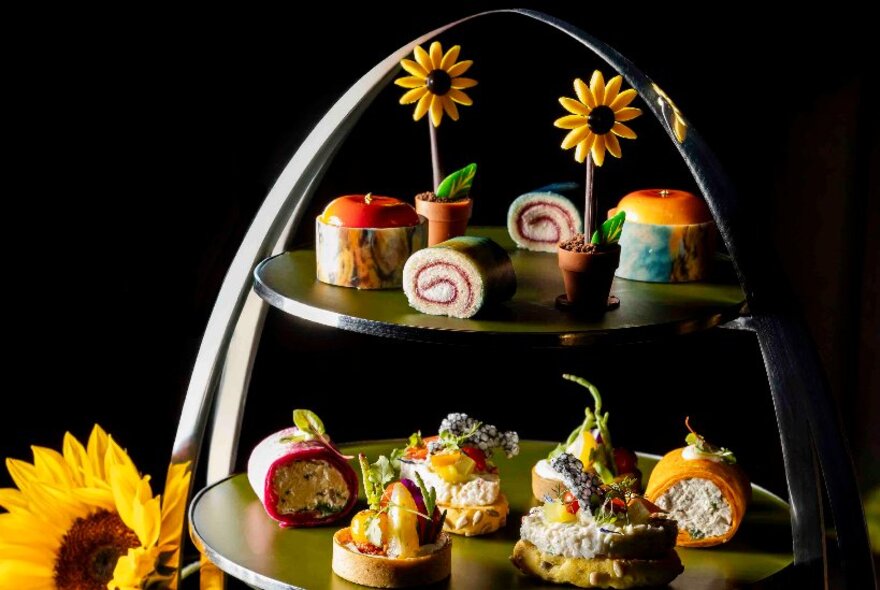 A Van Gogh High Tea with sunflowers and small sweet and savoury bites