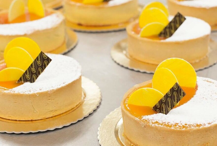 Orange-coloured cakes, garnished with a chocolate wafer