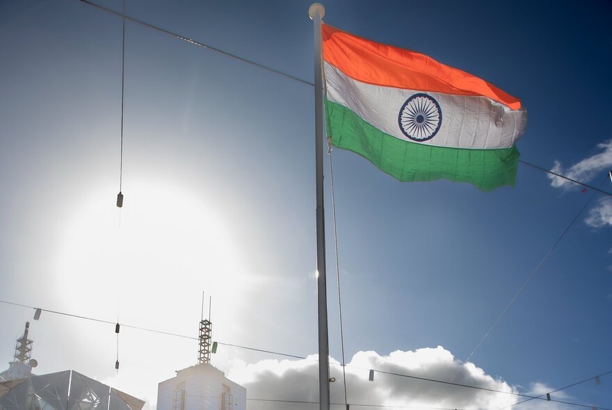 The Indian flag on a large flagpole. 