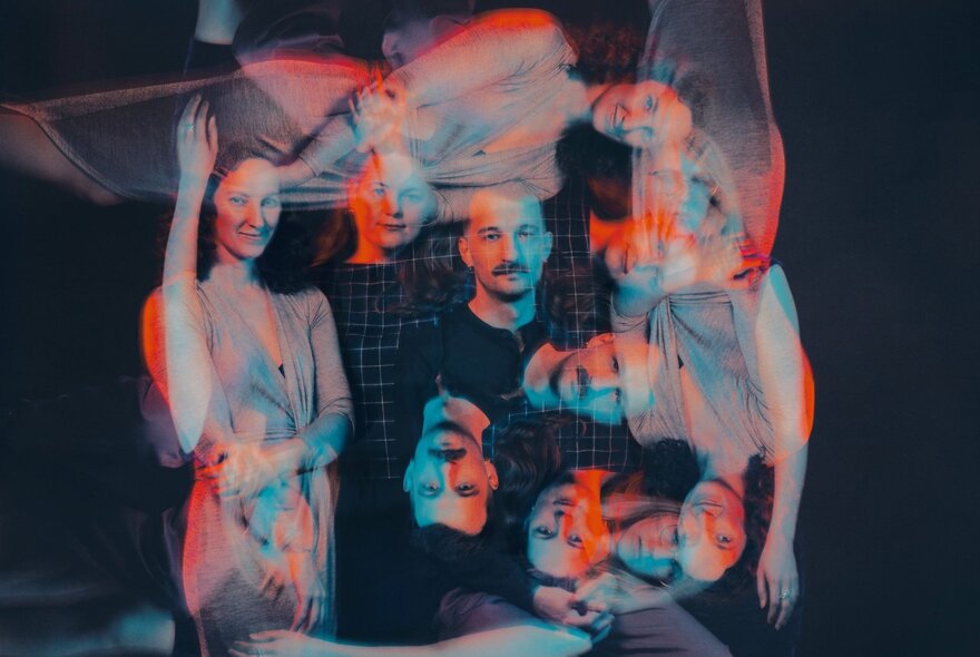 A colour filtered  image of people that is overlayed with repeat of the image at right angles. 