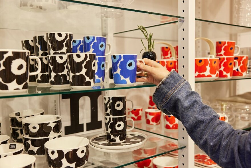 A shop display of Marimekko poppy mugs.