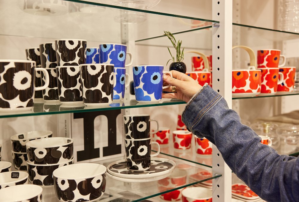 A shop display of Marimekko poppy mugs.