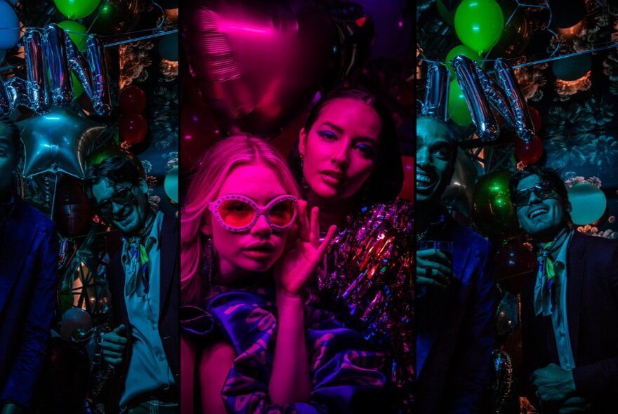 People celebrating New Year's Eve in a bar, with balloons and drinks in hand, image divided into three vertical strips with overlaid pink and blue filters.