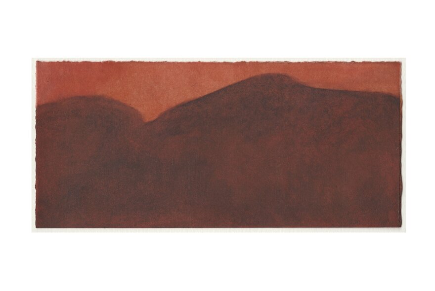 A print of hills in ochre colours.
