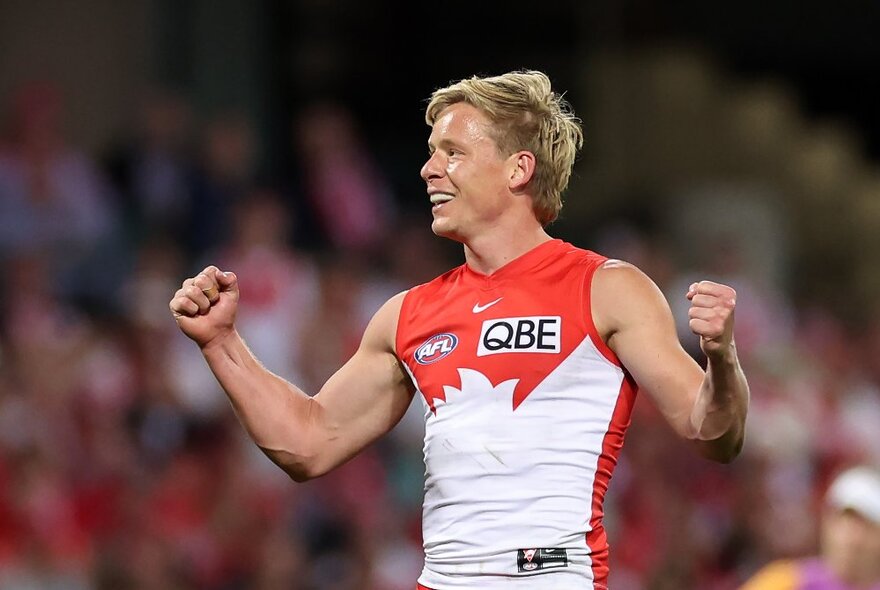 Isaac Heeney from the Sydney Swans celebrates on the football field. 