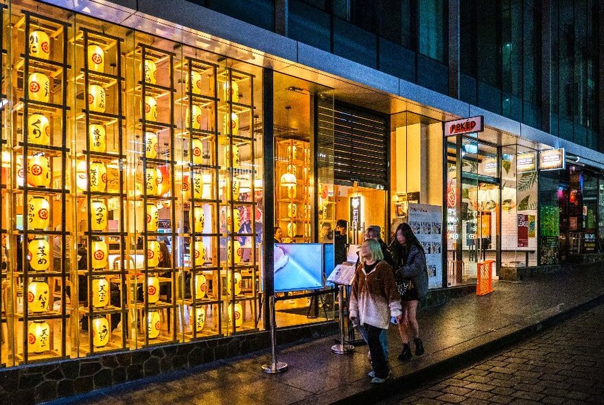 A laneway restaurant with glowing lanterns