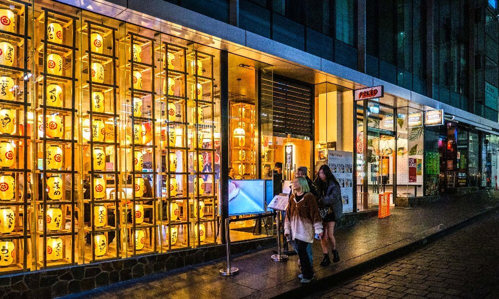 A laneway restaurant with glowing lanterns