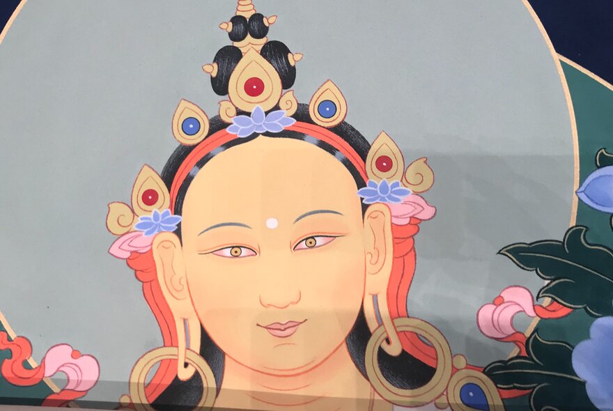 Image of Buddhist Tara figure with headdress.