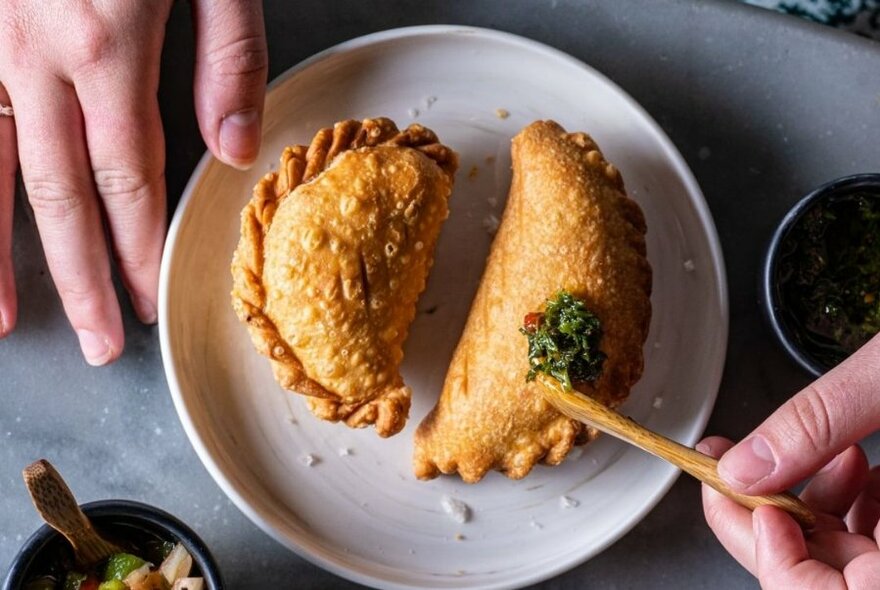 Two pastry parcels on a plate.