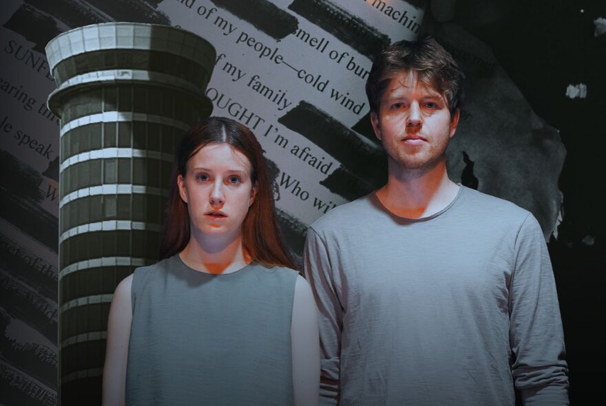 Male and female actors standing straight, wearing grey.
