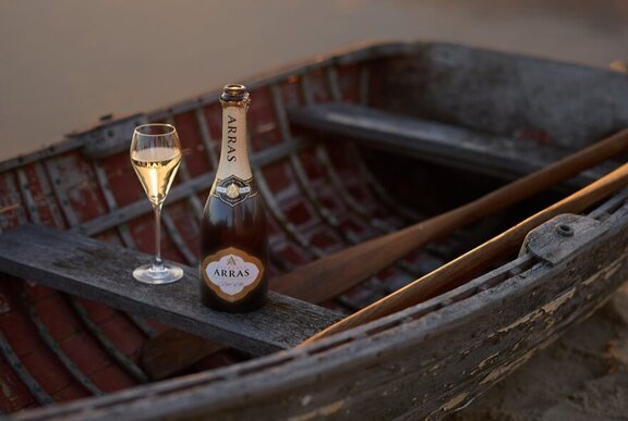 Bottle of champagne with glass.