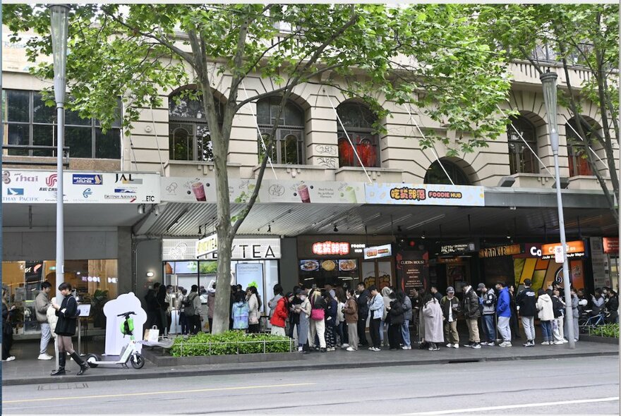 A large crowd of people waiting to buy tea from Heytea, Chinese global tea sensation.