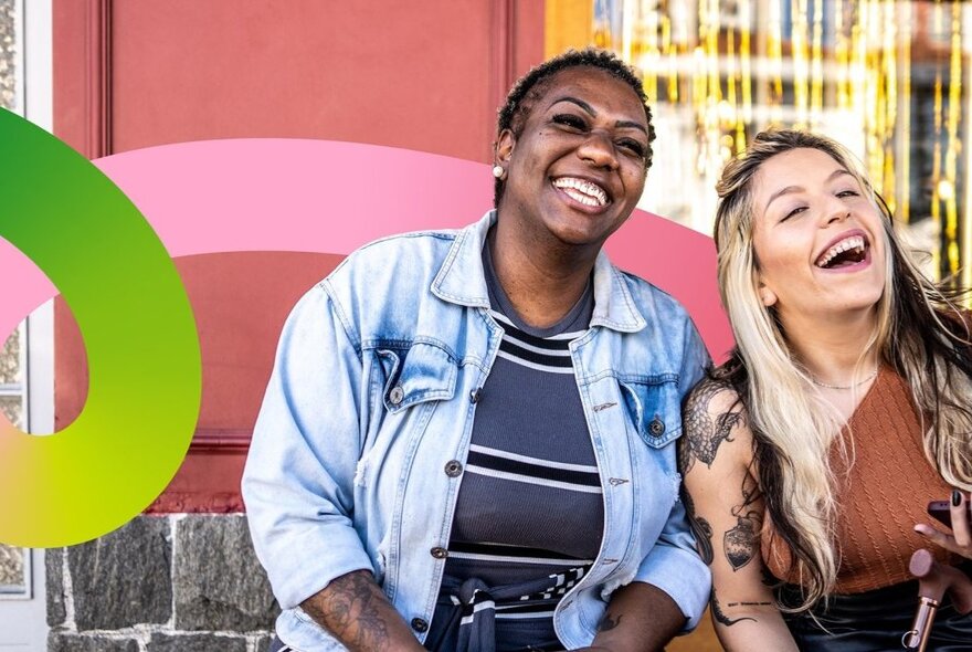 Two individuals smiling and enjoying a sunny day outdoors, with a curved green and pink stripe overlaid over the image.