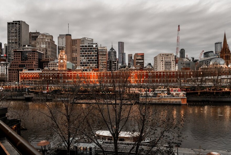 A view of Melbourne's Flinders Street station on a wintry day, seen from the other side of the Yarra River.