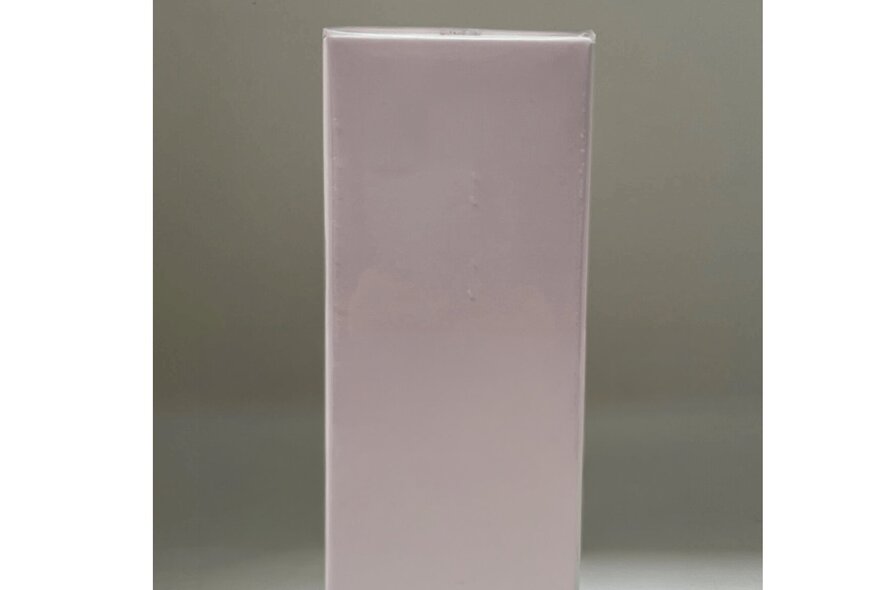 A pale purple rectangular shaped stand in a room.