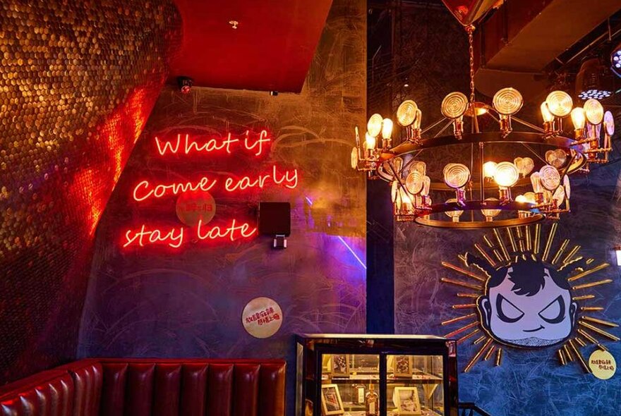 Interior of bar with red neon sign