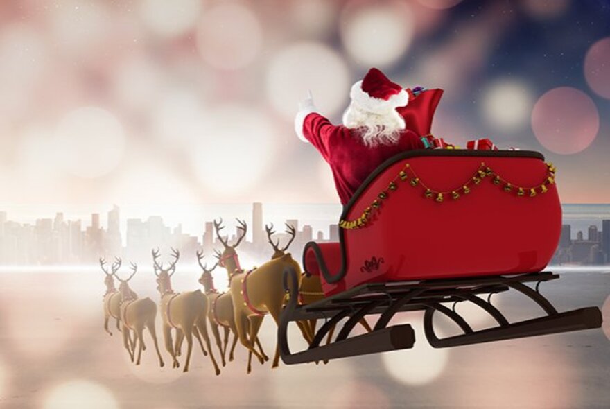 The back view of Santa riding away in his sleigh being pulled by reindeer.