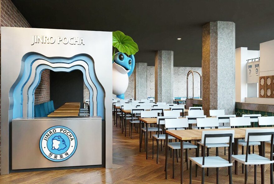 The interior of Jinro Pocha Korean restaurant, with empty white chairs and booth. 