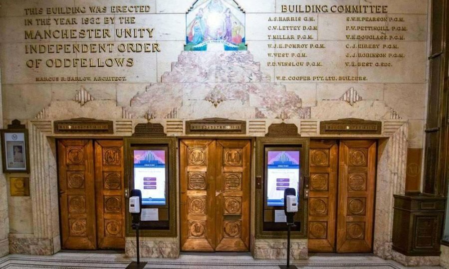 An elevator entrance with golden doors