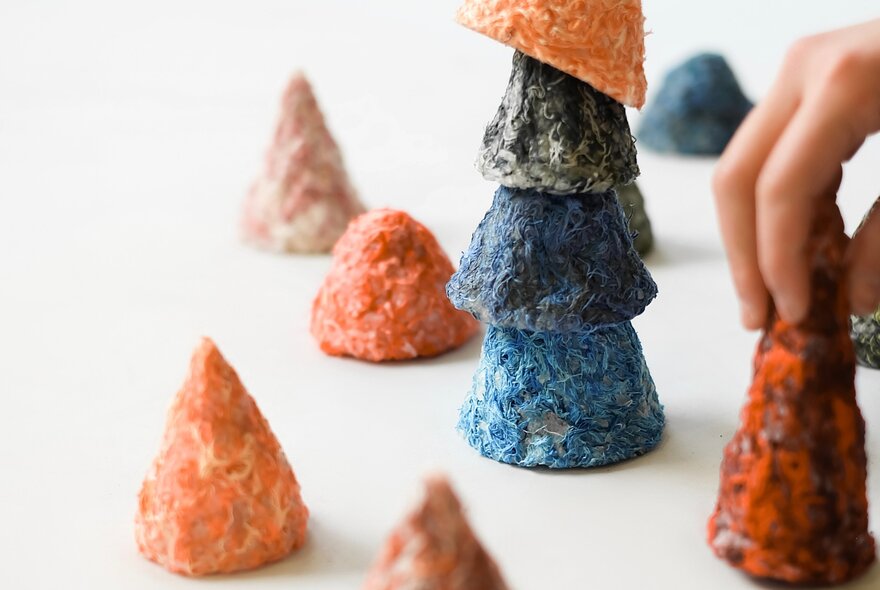 Pyramids of rice dyed different colours.