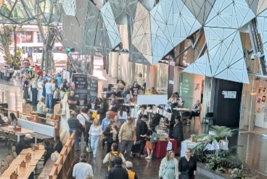 A crowd of people at Fed Square in Melbourne.