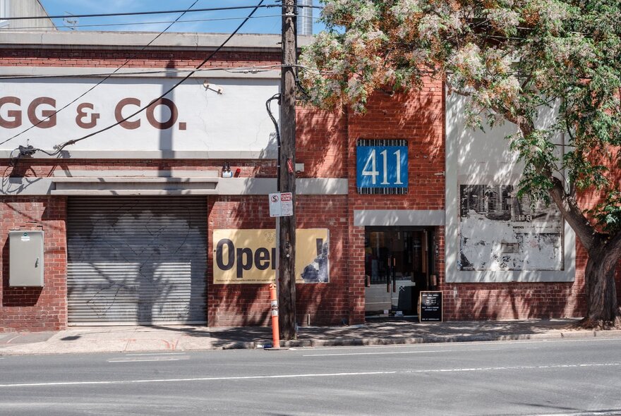 The red-brick external facade of a Melbourne whisky distillery warehouse.