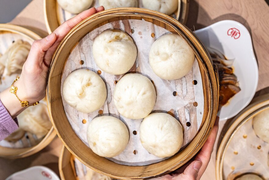Dumplings in a bamboo steamer.