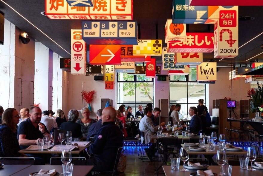 A group of people in a Japanese restaurant.