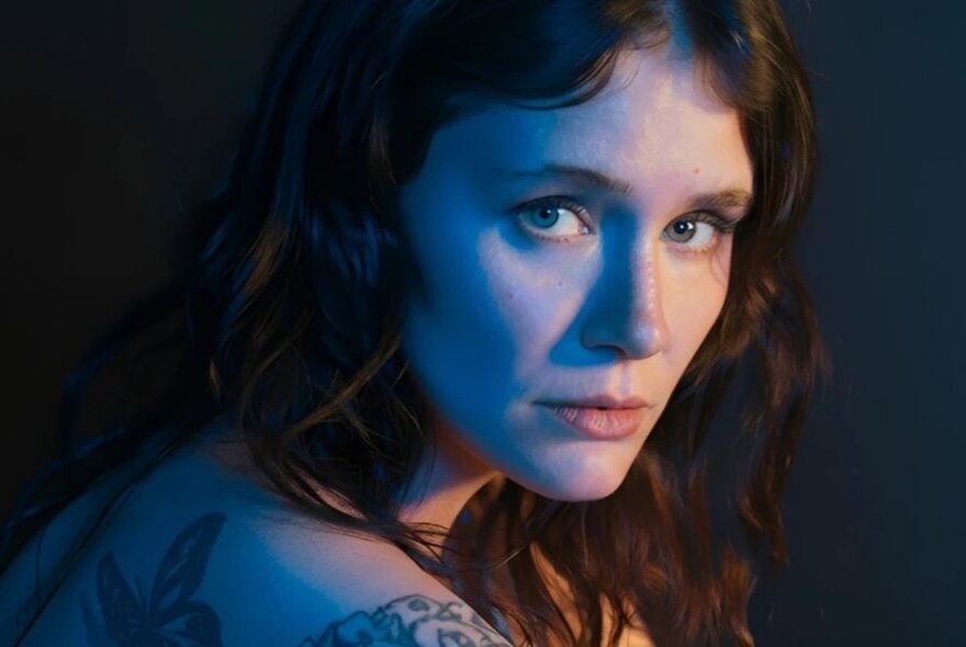 Irish composer Emma O’Halloran looking mournfully over her shoulder. 